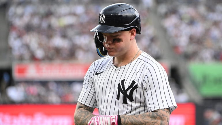 Yankees leftfielder Alex Verdugo returns to the dugout after grounding...