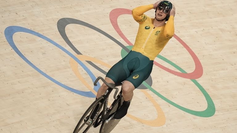 Matthew Richardson of Australia celebrates winning a men's sprint semifinals,...