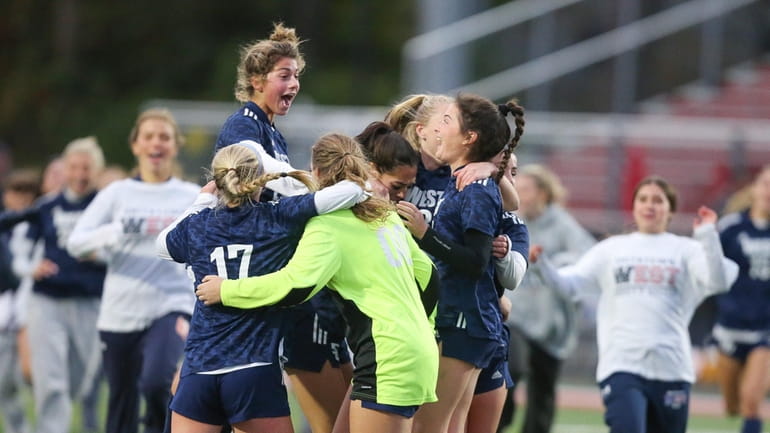 Smithtown West celebrates its win during the Suffolk Class AA...