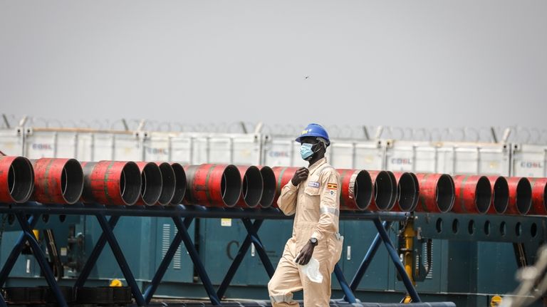 A Ugandan worker from China Oilfield Services Limited (COSL), a...