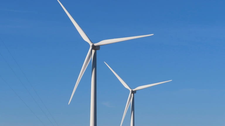 Land-based wind turbines spin in Atlantic City. N.J. on Nov....
