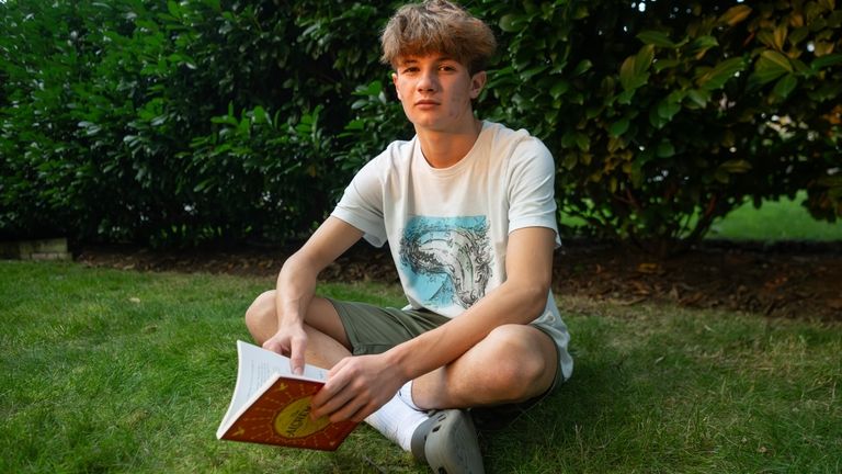 Chris Stanislawski, 14, poses for a portrait outside of his...