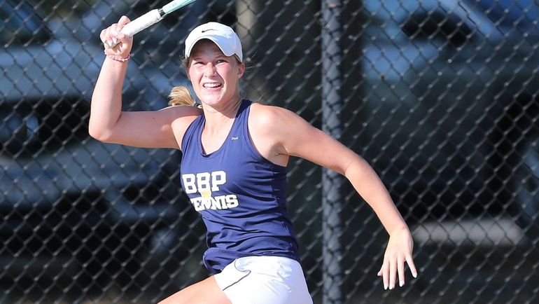 Phantoms’ Emilia Romano returns a serve during 6-1, 7-5 first...