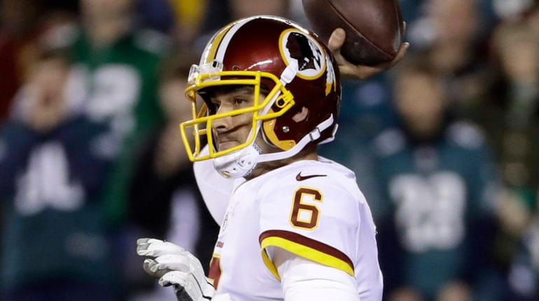 Redskins quarterback Mark Sanchez passes during the first half of a...