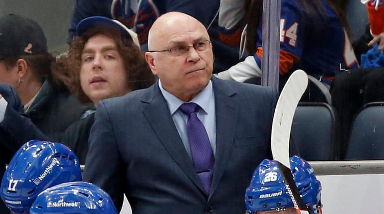 Head coach Barry Trotz of the Islanders looks on from...