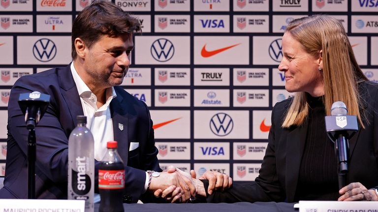 Mauricio Pochettino, left, the newly appointed head coach of the...