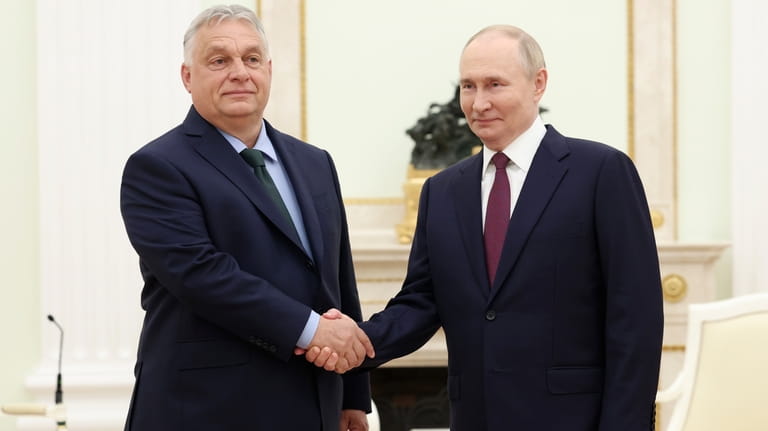 Russian President Vladimir Putin, right, and Hungarian Prime Minister Viktor...