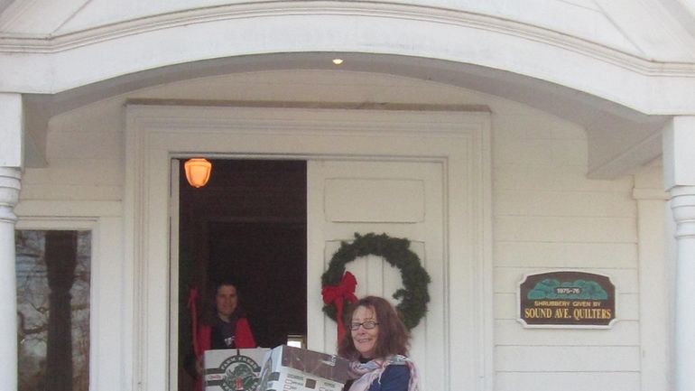 First Parish Church Trustee Lisa Barrow with food donations (Jan....