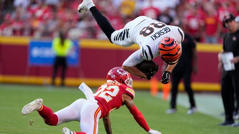 Cincinnati Bengals tight end Mike Gesicki (88) leaps over Kansas...