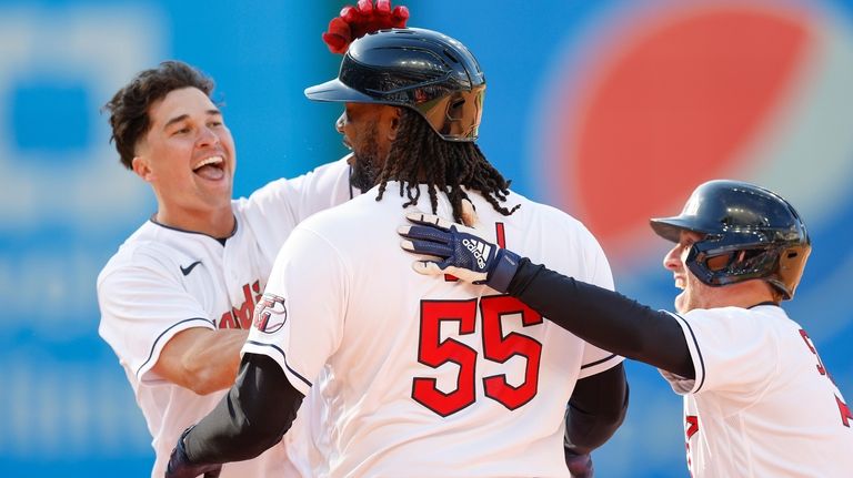 Seattle Mariners' Teoscar Hernandez hits an RBI single off Cleveland  Guardians relief pitcher Nick Sandlin during the 12th inning of a baseball  game, Sunday, April 9, 2023, in Cleveland. (AP Photo/Ron Schwane