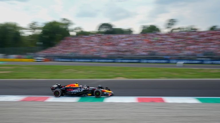 Red Bull driver Max Verstappen of the Netherlands steers his...