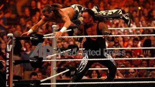 Undertaker delivers "snake eyes" to Shawn Michaels at WrestleMania XXVI...