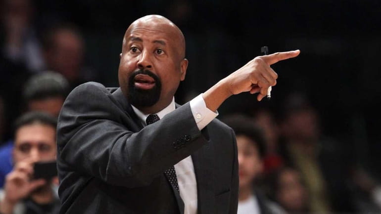Mike Woodson of the New York Knicks in action against...