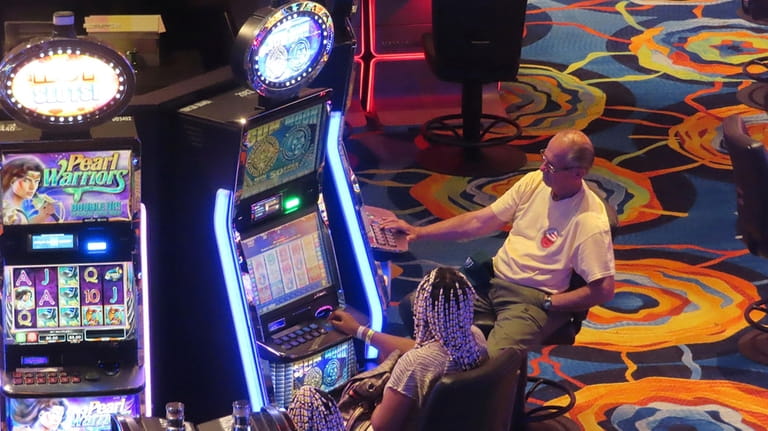 Gamblers play slot machines at the Ocean Casino Resort in...