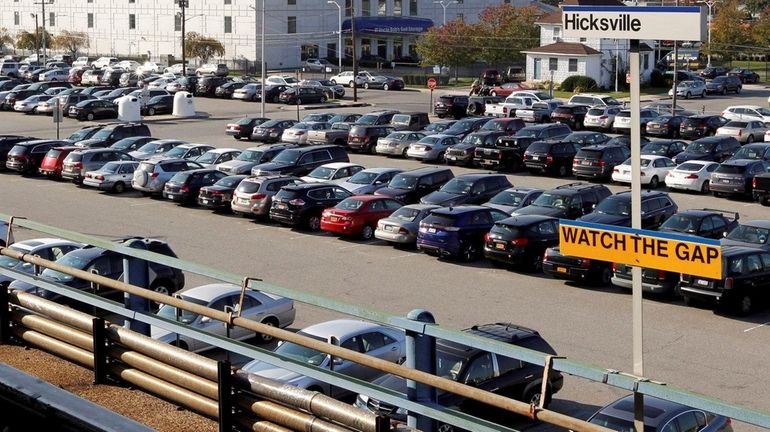 Vehicles fill the lot at the Hicksville LIRR station on...