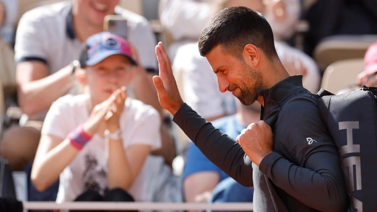 Serbia's Novak Djokovic arrives for a training session at the...