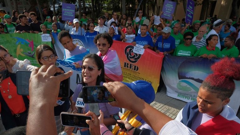 Abortion activists protest the proposal of a law, under debate...