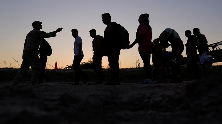 Migrants who crossed the Rio Grande and entered the U.S....