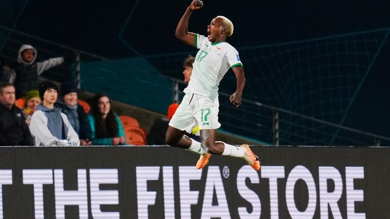 Zambia's Racheal Kundananji celebrates after scoring her team's third goal...