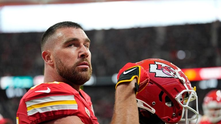 Kansas City Chiefs tight end Travis Kelce warms up before...