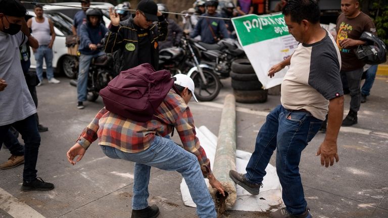 People block the Inter-American Highway in San Lucas Sacatepéquez, Guatemala,...