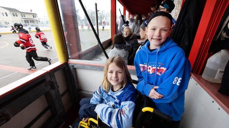 Colin Moon, 9, left, and his sister, Brianne, 11, at the tournament...