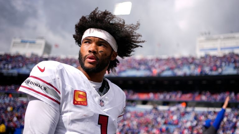 Arizona Cardinals quarterback Kyler Murray walks off the field after...