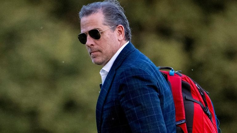 Hunter Biden, the son of President Joe Biden, walks from...