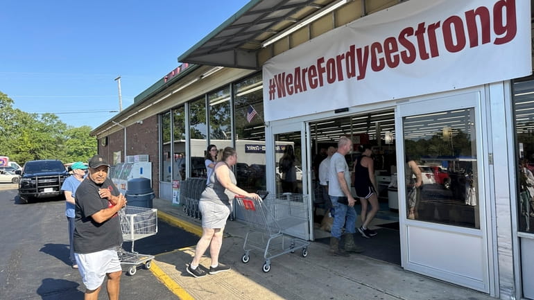 Shoppers enter the Mad Butcher grocery store in Fordyce, Arkansas...