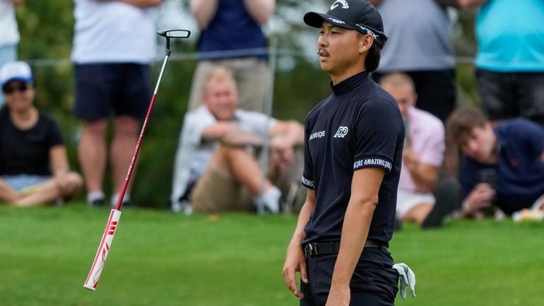 Australia's Min Woo Lee reacts after missing a birdie putt...