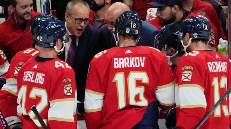 Florida Panthers head coach Paul Maurice talks to players during...