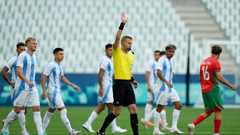 Referee Glenn Nyberg disallows a goal scored by Argentina's Cristian...