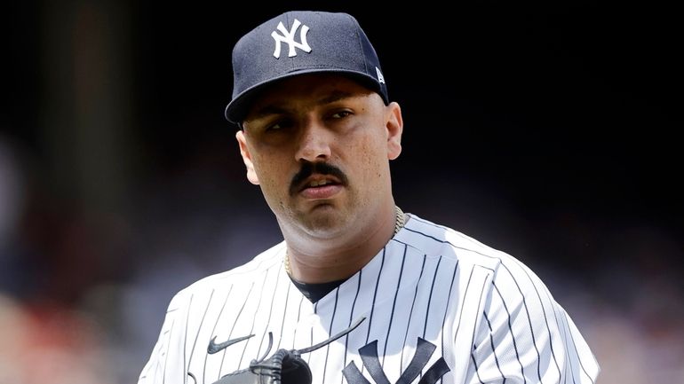 Nestor Cortes of the Yankees walks to the dugout after the...