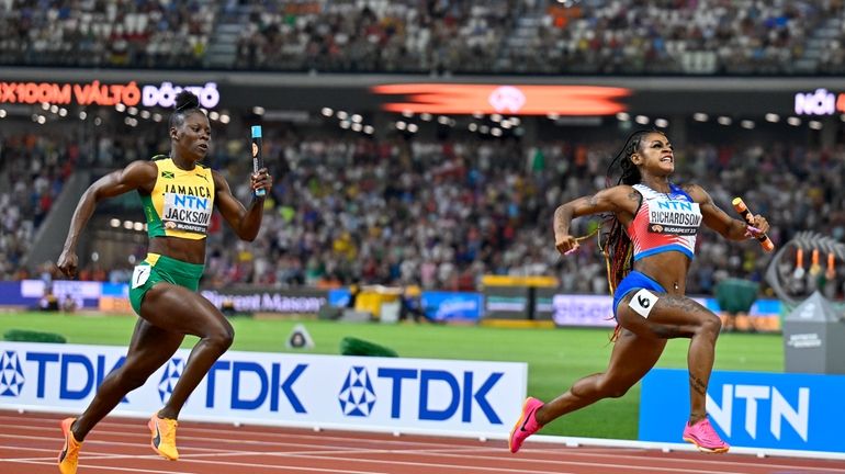 FILE = Sha'Carri Richardson, of the United States celebrates anchoring...