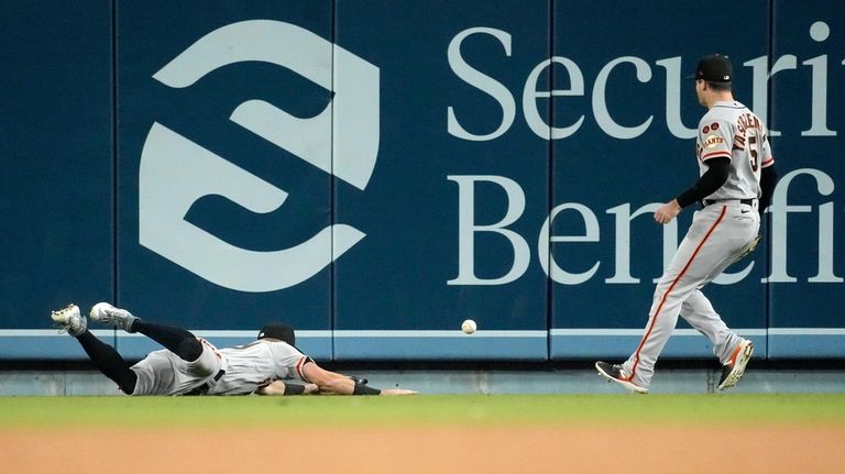 San Francisco Giants center fielder Tyler Fitzgerald slides after attempting...