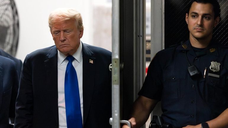 Former President Donald Trump returns to the courthouse moments before...