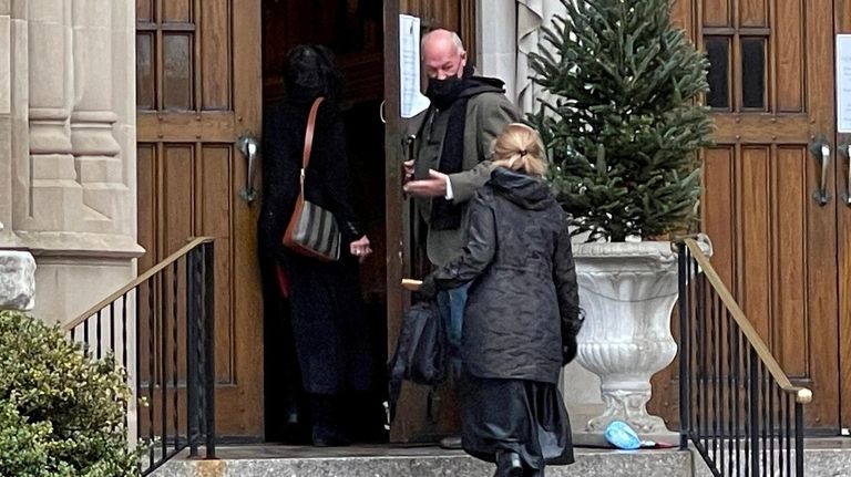 Parishioners arrive for Christmas Mass at St. Agnes Cathedral on...