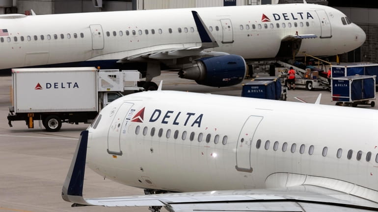 A Delta Air Lines plane leaves the gate on July...