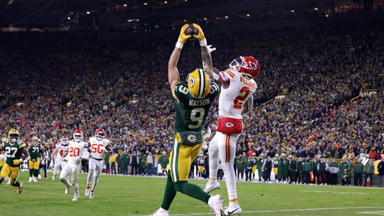 Green Bay Packers wide receiver Christian Watson (9) catches a...