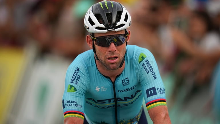 Britain's Mark Cavendish crosses the finish with a considerable delay...
