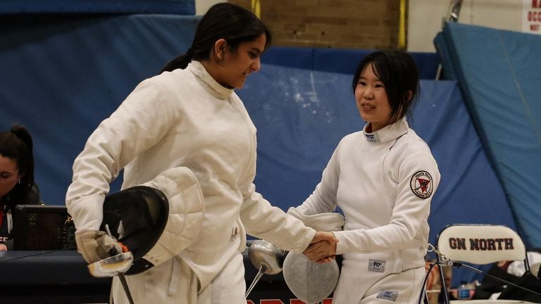 Justina Hom, right, of Great Neck South is congratulated by Rhea...