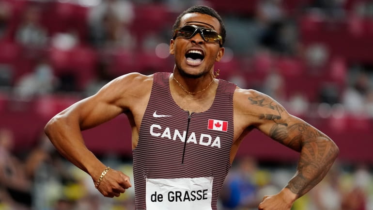 Canada's Andre De Grasse races to a gold medal in...