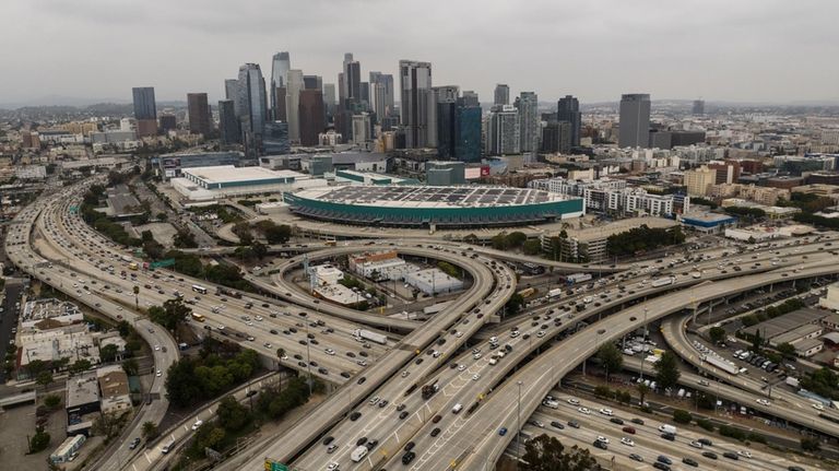 This aerial view shows the 10 and 110 Freeway interchange...