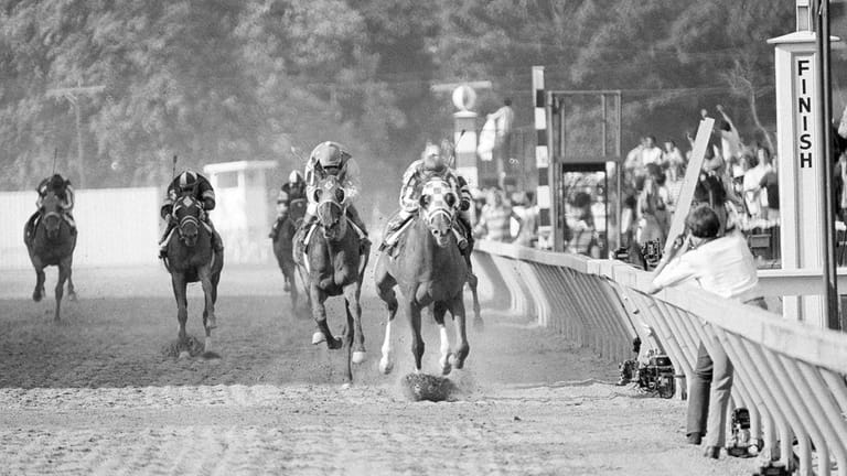 Secretariat, front, with Ron Turcotte up, wins the 98th running...