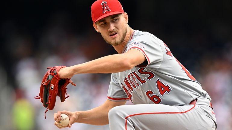 Los Angeles Angels staring pitcher Jack Kochanowicz winds up to...