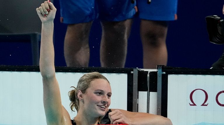 Summer McIntosh, of Canada, celebrates after winning the women's 400-meter...