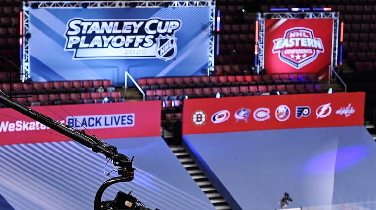 NHL signage is viewed along with a high-angle television camera...