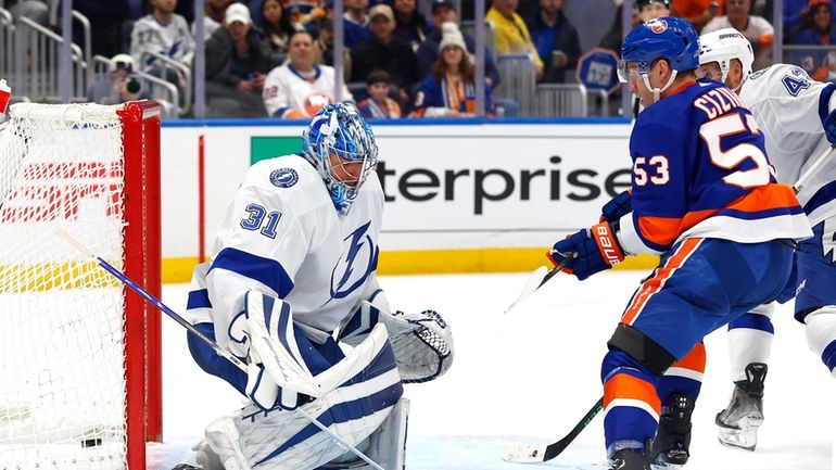 Islanders center Casey Cizikas scores against Lightning goaltender Jonas Johansson during...