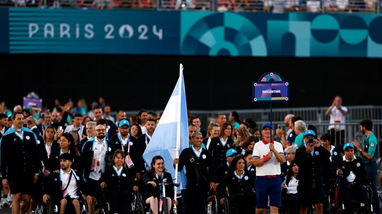 Flagbearers Hernan Barreto of Argentina and Coty Garrone of Argentina...