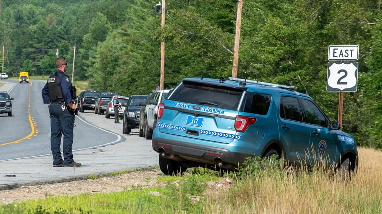 Maine State Police troopers, tactical team members, local and county...